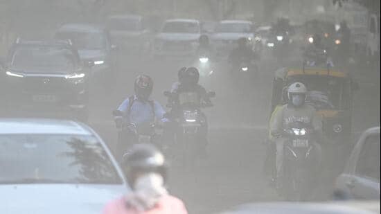 Commuters make their way through a haze-covered and dusty stretch of road as air pollution levels rise in the national capital in New Delhi, India, on September 22, 2026 (HT Photo/Sanchit Khanna)