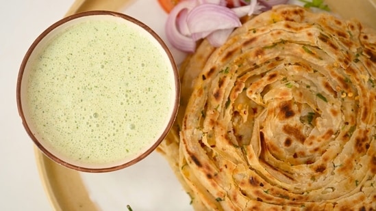 Kunal Kapur’s chilli-garlic laccha paratha with chutney raita takes 35 minutes to make. (chefkunalkapur.com)