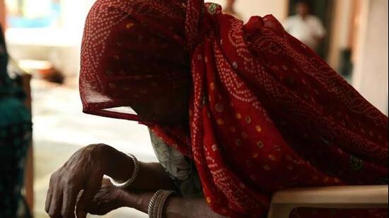 The woman alleged that a group of villagers barged into her house when her husband and son were not at home.