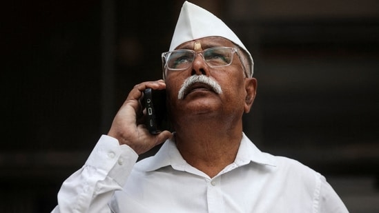 A man looks at a screen outside the Bombay Stock Exchange (BSE) building in Mumbai (Reuters File)