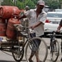 A-delivery-man-carrying-LPG-cylinders-at-Kitchlu-Nagar-in-Ludhiana-on-Wednesday-JS-Grewal-HT