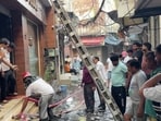 A firefighting operation underway in Dhobiyan Wali Gali, Khanna, on Thursday. (HT Photo)