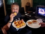 Anubhav Sinha relishing samosas from Gayatri Sweets in Cantt on his visit to Lucknow (Photo: HT)