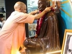 Chief minister Yogi Adityanath pays homage to Mahatma Gandhi and former Prime Minister Lal Bahadur Shastri on their birth anniversaries, in Lucknow on Friday. (ANI Photo)