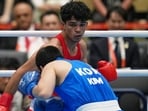 India's Ankush, in red, and South Korea's Kim Min-seong, in action in the men’s 80kg final. (AP Photo/Lee Jin-man)