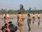 A police official at the site after eight male students of a private coaching institute, 'Winners Academy', drowned in the Arabian Sea while on a picnic at Diveagar beach.
