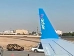 This screengrab, taken from a handout video via AFPTV, shows first responders outside the rerouted flydubai flight FZ 1073, ahead of its departure to Tel Aviv from Saudi Arabia's Tabuk airport. 