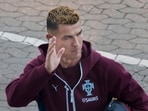Cristiano Ronaldo waves to fans as he arrives for a training session at Parken Stadium in Copenhagen, Denmark.