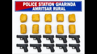 In a major crackdown on arms and drug smuggling, the Amritsar Rural Police recovered 10 kg heroin and 10 illegal pistols with the arrest of four operatives of two separate crime networks, said Punjab director general of police (DGP) Gaurav Yadav on Friday. (HT Photo)