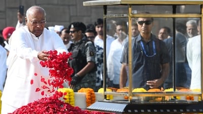 Congress president and Rajya Sabha LoP Mallikarjun Kharge pays floral tribute to Mahatma Gandhi at Raj Ghat on Gandhi Jayanti, in New Delhi on Friday. (ANI) Congress president and Rajya Sabha LoP Mallikarjun Kharge pays floral tribute to Mahatma Gandhi at Raj Ghat on Gandhi Jayanti, in New Delhi on Friday. (ANI)