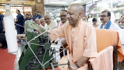 UP CM Yogi Adityanath tries his hands on 'Charkha', a traditional manual spinning wheel Mahatma Gandhi promoted as a core symbol of the Swadeshi Movement during the independence struggle (Deepak Gupta/Hindustan Times) UP CM Yogi Adityanath tries his hands on 'Charkha', a traditional manual spinning wheel Mahatma Gandhi promoted as a core symbol of the Swadeshi Movement during the independence struggle (Deepak Gupta/Hindustan Times)
