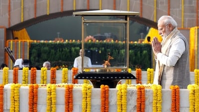 Prime Minister Narendra Modi pays homage to Mahatma Gandhi at Rajghat on Gandhi Jayanti, in New Delhi on Friday. (Narendra Modi Photo Gallery) Prime Minister Narendra Modi pays homage to Mahatma Gandhi at Rajghat on Gandhi Jayanti, in New Delhi on Friday. (Narendra Modi Photo Gallery)