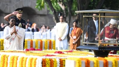President Droupadi Murmu pays homage to Mahatma Gandhi at Raj Ghat on Gandhi Jayanti, in New Delhi on Friday. (ANI) President Droupadi Murmu pays homage to Mahatma Gandhi at Raj Ghat on Gandhi Jayanti, in New Delhi on Friday. (ANI)