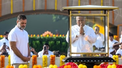 AICC president and Rajya Sabha LoP Mallikarjun Kharge pays homage to Mahatma Gandhi at Raj Ghat on Gandhi Jayanti, in New Delhi on Friday. Lok Sabha LoP Rahul Gandhi also present. (ANI) AICC president and Rajya Sabha LoP Mallikarjun Kharge pays homage to Mahatma Gandhi at Raj Ghat on Gandhi Jayanti, in New Delhi on Friday. Lok Sabha LoP Rahul Gandhi also present. (ANI)