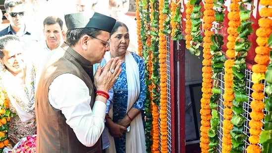 Uttarakhand Chief Minister Pushkar Singh Dhami pays tribute to who made the supreme sacrifice on the anniversary of the Rampur firing incident at the Martyrs' Memorial, in Dehradun on Friday.