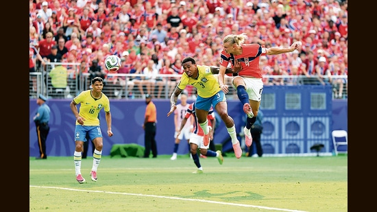 Norway’s Erling Haaland (below, right) scores against Brazil during the FIFA World Cup 2026. A footballer may be the most comp-lete athlete in the world: running, jumping, sprinting, braking, with power and flexibility. (Getty Images)
