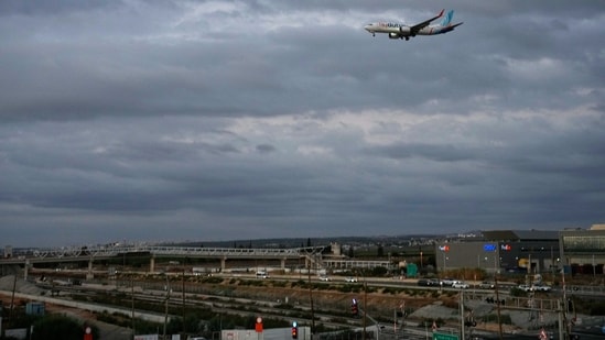 A flydubai plane carrying Israeli passengers who had earlier been aboard another aircraft that made an emergency landing in Saudi Arabia approaches Ben Gurion International Airport near Tel Aviv, Israel.