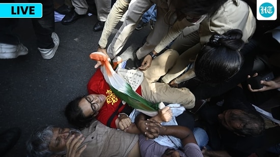 Delhi police officals detained members of SFI and DYFI protest against the Election Commission and SIR exercise at Jantar Mantar in New Delhi