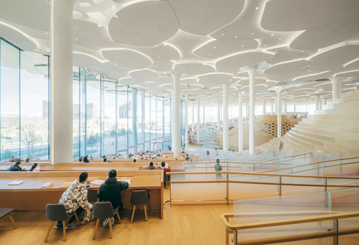 The Beijing Library’s interiors, designed like rolling hills, have sensor-enabled columns that can regulate climate, lighting and acoustics, as well as harvest rainwater. (Snohetta) The Beijing Library’s interiors, designed like rolling hills, have sensor-enabled columns that can regulate climate, lighting and acoustics, as well as harvest rainwater. (Snohetta)