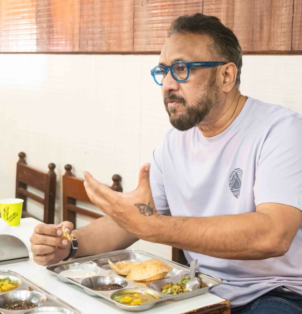 Anubhav Sinha savouring kachauri at Netram, Aminabad Anubhav Sinha savouring kachauri at Netram, Aminabad