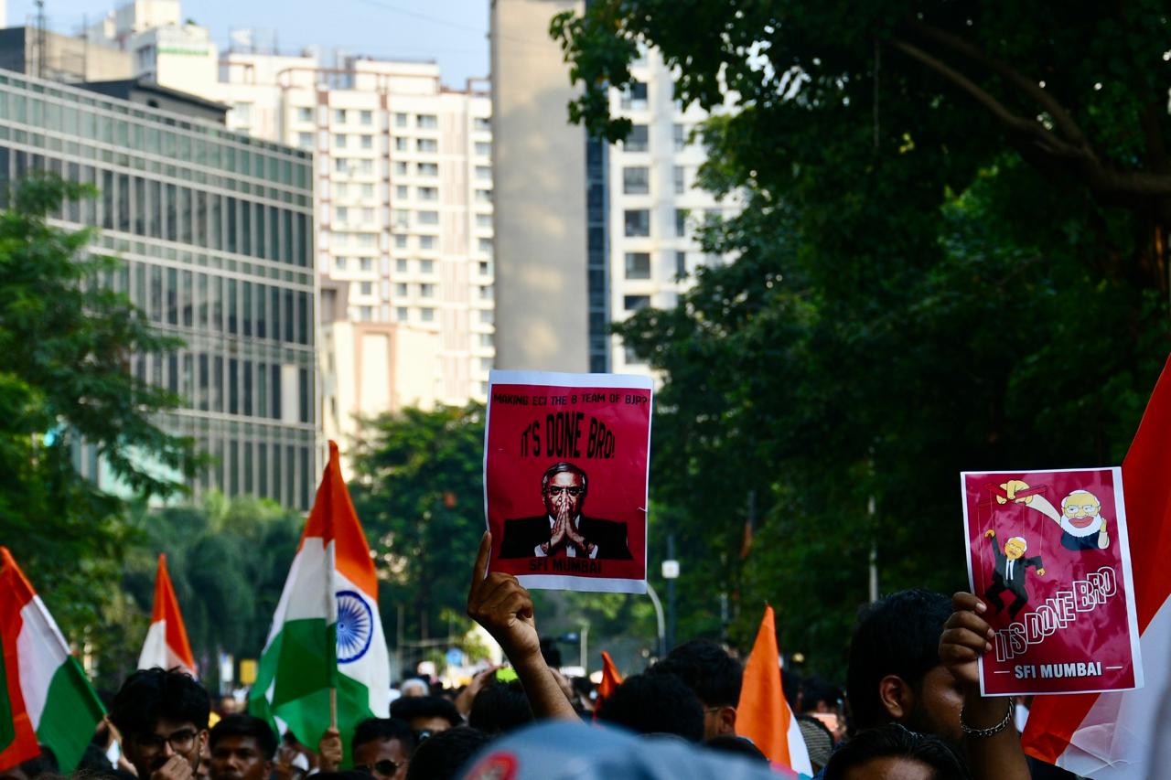Protesters at Mumbai's Shivaji Park holding posters as they demand CEC Gyanesh Kumar's resignation.