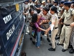 Police detain a woman protester near Jantar Mantar during a protest seeking Chief Election Commissioner Gyanesh Kumar's resignation over voter roll deletions, in New Delhi on Friday. 
