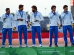 The Indian team with the gold medal.