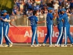 Indian team members celebrate after winning gold medal cricket match between India and Pakistan at the Asian Games in Nagoya, Japan