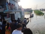 Floodwaters surged back into narrow lanes and modest homes on Friday. (Deepak Gupta/HT Photo)