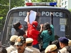 A protester in a Spideman costume climbs onto the front glass of a police bus during a protest seeking Chief Election Commissioner Gyanesh Kumar's resignation over voter roll deletions near Jantar Mantar, in New Delhi on Friday. 