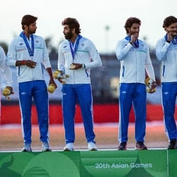 The Indian team with the gold medal.