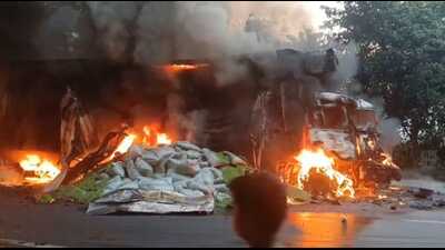 Burnt-out trucks on the Agra-Aligarh highway on Saturday (HT )