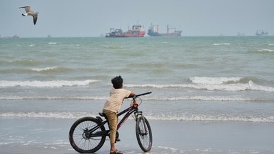 A gull flies overhead as a boy stands with his bicycle on a beach overlooking commercial vessels anchored in the Strait of Hormuz off Bandar Abbas, Iran, Monday, Sept. 7, 2026. (AP Photo/Vahid Salemi, File) (AP Photo/Vahid Salemi) A gull flies overhead as a boy stands with his bicycle on a beach overlooking commercial vessels anchored in the Strait of Hormuz off Bandar Abbas, Iran, Monday, Sept. 7, 2026. (AP Photo/Vahid Salemi, File) (AP Photo/Vahid Salemi)