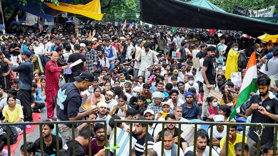 People sit at the protest site at Jantar Mantar supporting the Cockroach Janata Party's (CJP) protest, over alleged examination irregularities and NEET paper leak.(Sathiya)