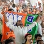 North 24 Parganas: A supporter holds a BJP flag during an election campaign rally addressed by Prime Minister Narendra Modi in support of party candidate Ratna Debnath and others at Panihati, in North 24 Parganas district of West Bengal, Friday, April 24, 2026. (PTI Photo/Swapan Mahapatra)(PTI04_24_2026_000110A)