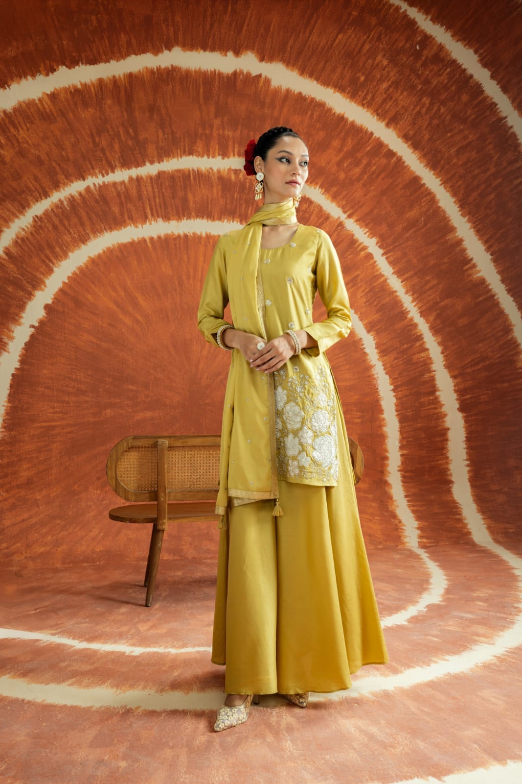 Opt for a palazzo set featuring a mustard or red kurta with an embroidered yoke and sequin accents that catch the light. (Libas) Opt for a palazzo set featuring a mustard or red kurta with an embroidered yoke and sequin accents that catch the light. (Libas)