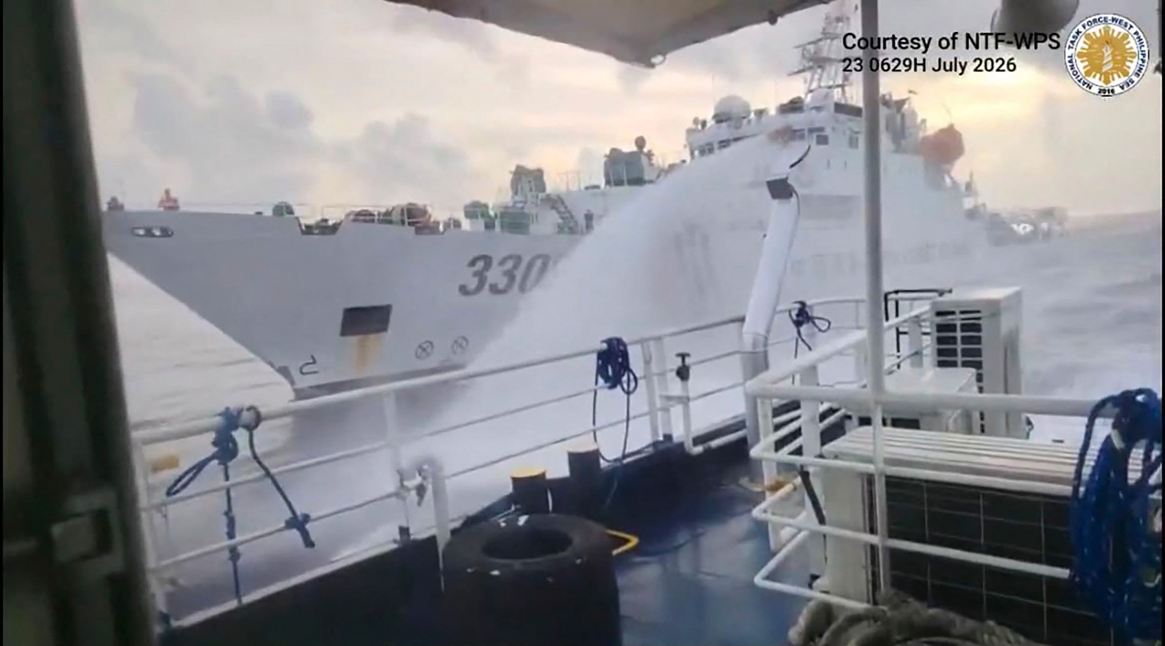 This handout screengrab released by the Philippine Coast Guard (PCG) shows a Chinese Coast Guard ship (back) water canonning a Philippines' ship near Scarborough Shoal, in the disputed South China Sea. (Philippine Coast Guard via AFP) This handout screengrab released by the Philippine Coast Guard (PCG) shows a Chinese Coast Guard ship (back) water canonning a Philippines' ship near Scarborough Shoal, in the disputed South China Sea. (Philippine Coast Guard via AFP)