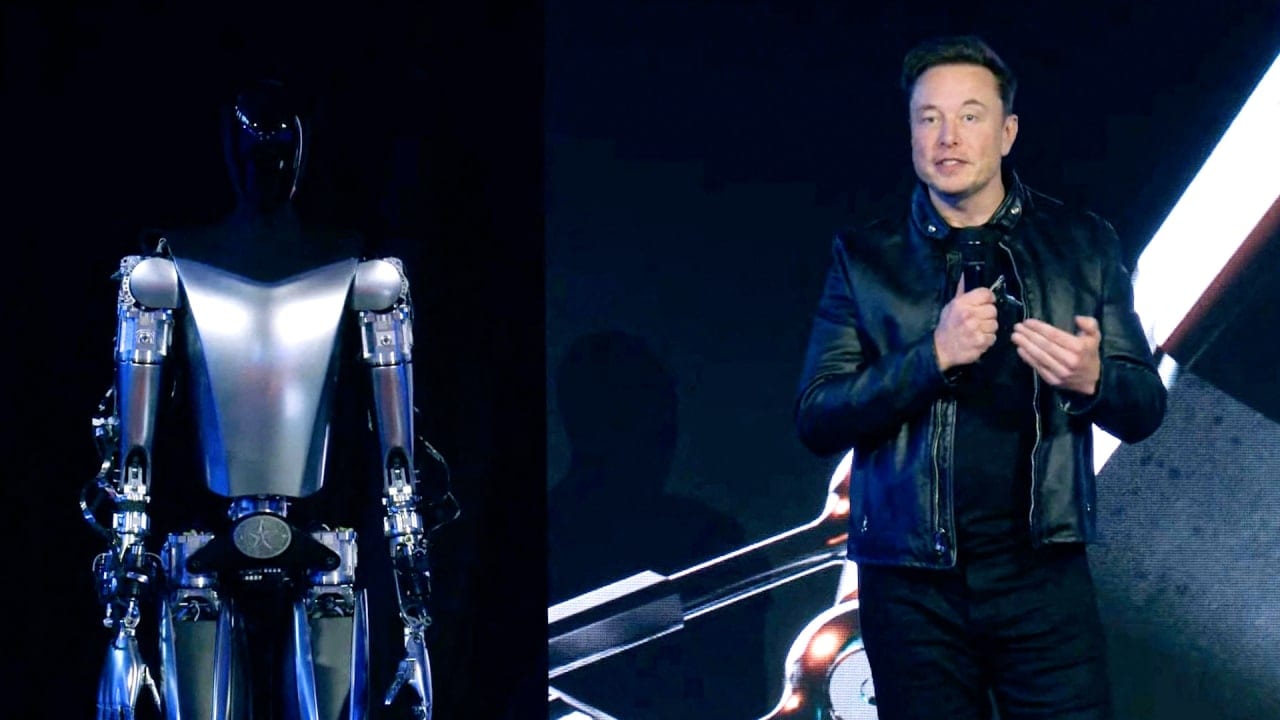 Elon Musk with a prototype of a humanoid robot from Tesla.