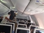 Screengrab of video showing Flydubai passengers reacting after realising there is commotion in the cockpit. (via REUTERS)