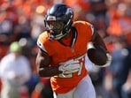 J.K. Dobbins #27 of the Denver Broncos runs with the ball.
