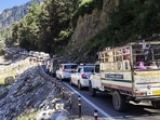 Long queue of cars and vehicles on the mountain road along the river as Manali experiences heavy tourist rush during the long weekend, in Manali on Saturday. (ANI Video Grab)