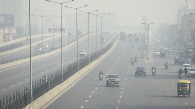 Gram it: Delhi woke up to hazier skies on Sunday as the city’s AQI slipped to 150, pushing the air quality in 'moderately polluted' category. As the smog became visible along the Delhi-Meerut Expressway and National Highway 9, near Mehrauli in Ghaziabad, here's how vehicles kept the headlights on amid reduced visibility. No rain is likely over the next week, according to the IMD, as the haze is expected to linger over the Capital. ( Photo: Sakib Ali/HT)
