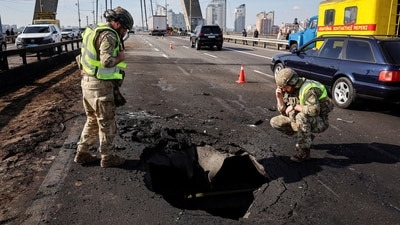 Police officers work at a site of the North Bridge hit by a Russian drone strike, amid Russia's attack on Ukraine, in Kyiv, Ukraine October 4, 2026. (REUTERS)