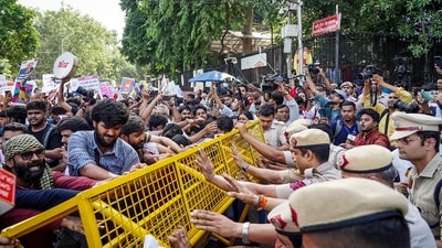 Protesters try to breach security barricades during a protest near Jantar Mantar, in New Delhi on Saturday. (ANI) Protesters try to breach security barricades during a protest near Jantar Mantar, in New Delhi on Saturday. (ANI)