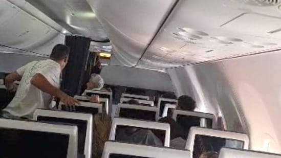 Screengrab of video showing Flydubai passengers reacting after realising there is commotion in the cockpit. 