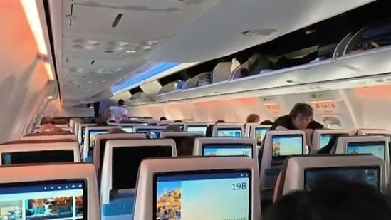 Screengrab showing passengers inside the rerouted flydubai flight FZ 1073, ahead of its departure to Tel Aviv from Saudi Arabia's Tabuk airport. (AFP)