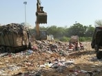 Bhawani Shankar Tripathi, a resident of Sector 23A, said that residents are frustrated with the foul smell reaching their homes from fresh waste being dumped at the site every day. (HT Photo)