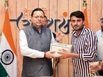 Uttarakhand Chief Minister Pushkar Singh Dhami during a meeting with youth creators of Haryana, under the Seva Sankalp Abhiyan, at the CM's official residence, in Dehradun.