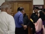 Security personnel trying to pacify the faculty members after they protest outside the VC office at Dr YS Parmar University of Horticulture and Forestry, Nauni, on Monday, (HT Photo)