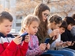 The authors call for coordinated governance of digital systems, with the health and online safety of children and young people be made an immediate global policy priority. (Shutterstock)